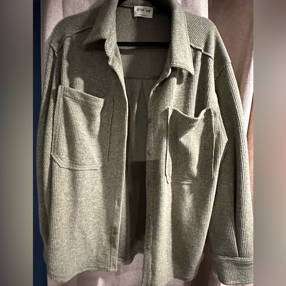New In olive cardigan/shirt with 2 breast pockets, raw edge seams.